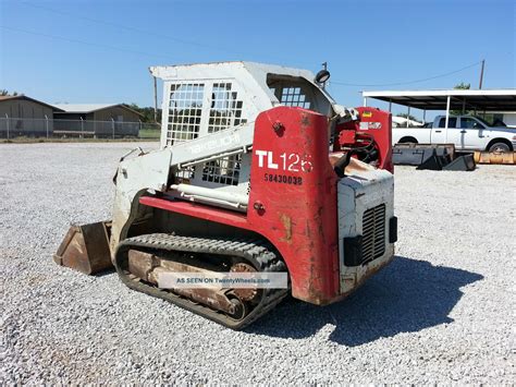 moving a takeuchi tl126 skid steer without power|moving non running skidsteer trailer.